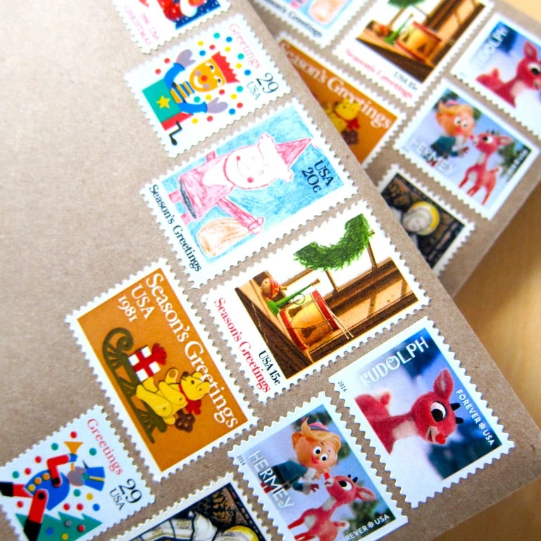 Philatelist using professional tongs to place a 45 cent love stamp into an archival album