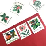 12 Christmas Stamps Unused Holly Poinsettia Mistletoe Evergreen Pinecone Vintage Stamps