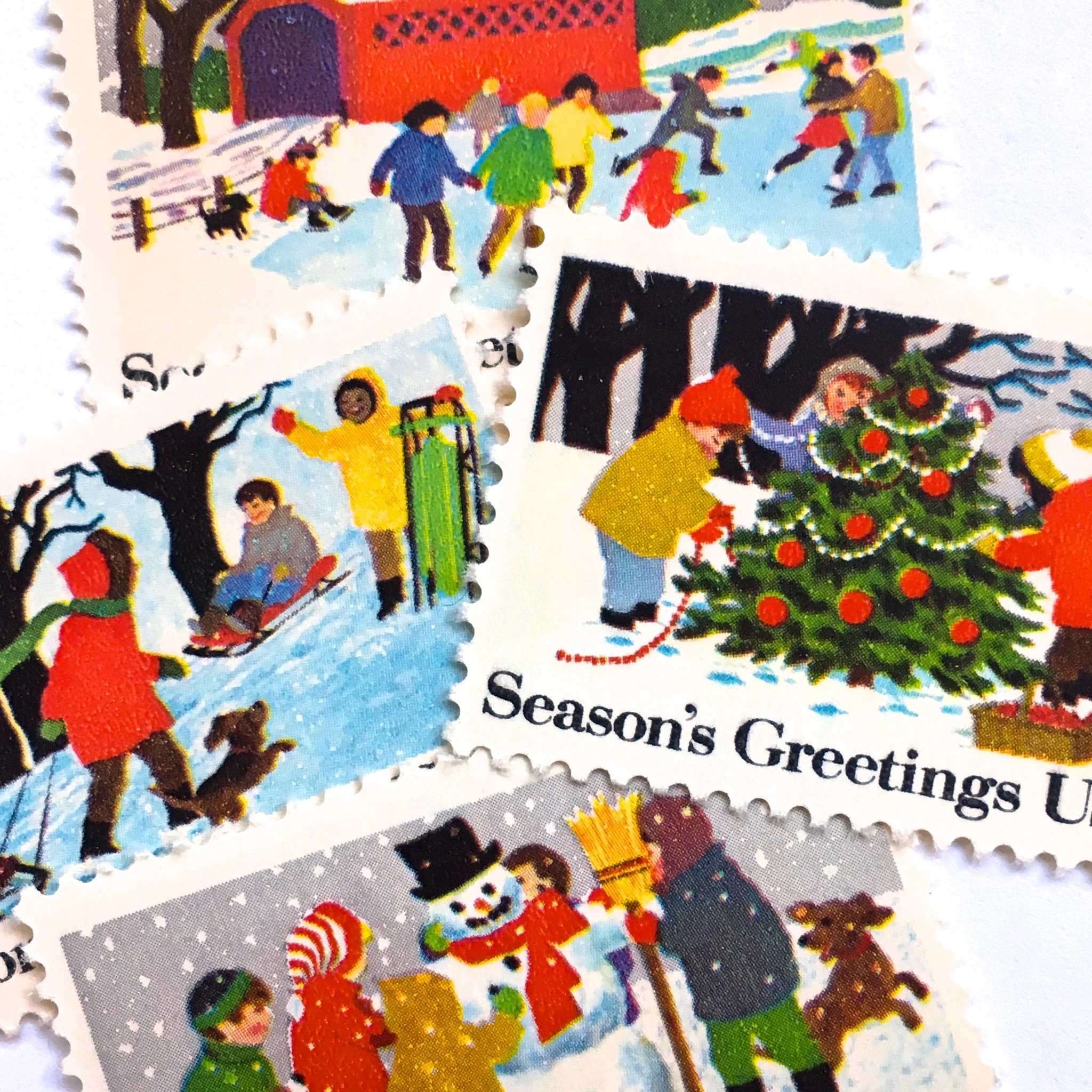 product_image_1774525190 12 Vintage Christmas Postage Stamps Unused Children Sledding Ice Skating Snow Man Building // 20 Cent Winter Holiday Stamps for Mailing