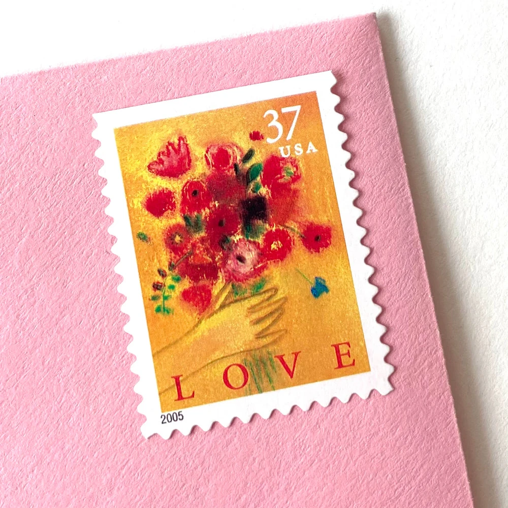 lover of stamps examining vintage romantic postage collection