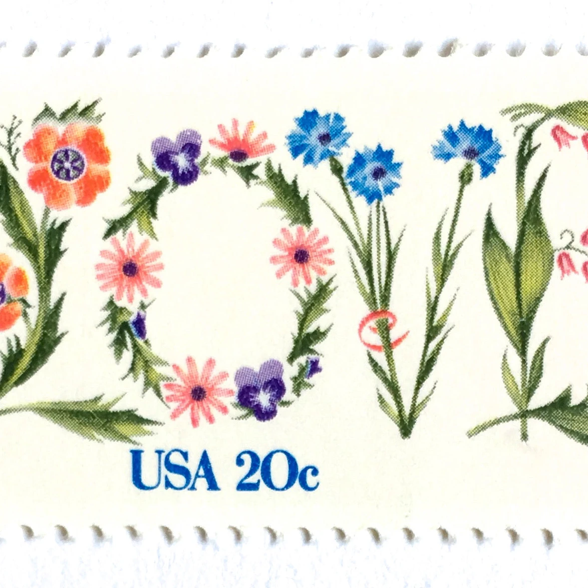 us post office love stamps collection display showing various romantic designs including hearts and swans