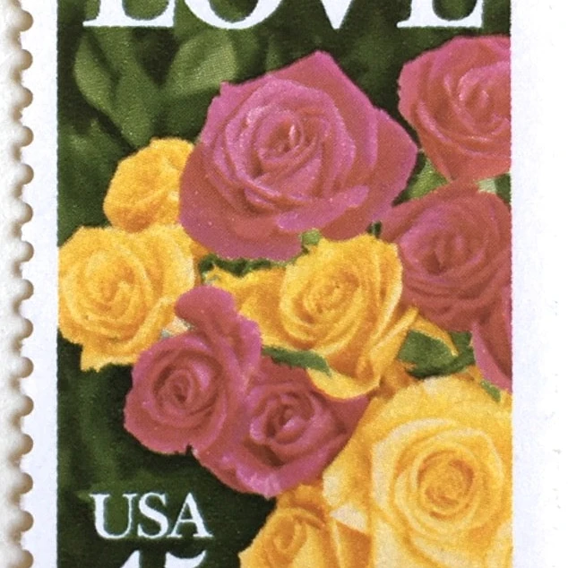 vintage love stamps featuring pink and yellow roses